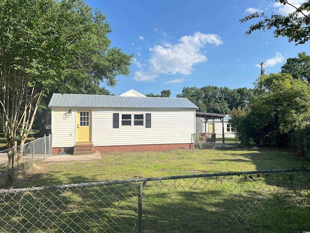 518 Nowell St, Georgetown, SC 29440 - view of front of home featuring entry steps, a metal roof, and a fenced backyard
