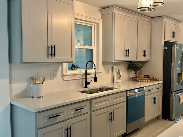 518 Nowell St, Georgetown, SC 29440 - kitchen featuring stainless steel fridge with ice dispenser, dishwasher, light wood-type flooring, and light stone countertops