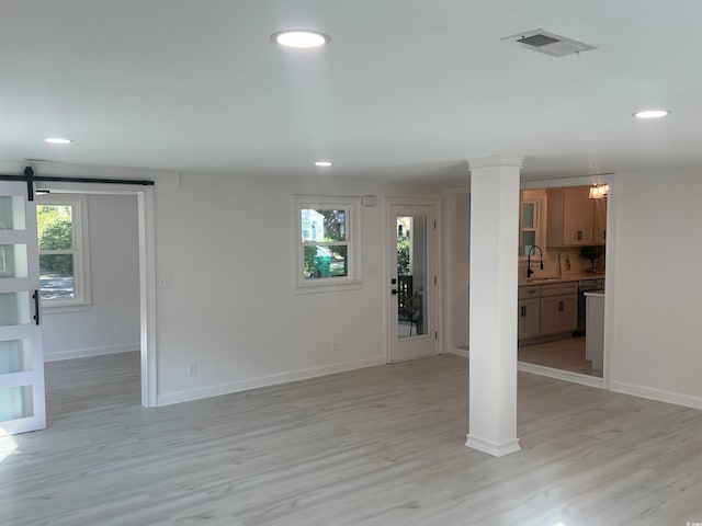 518 Nowell St, Georgetown, SC 29440 - basement with light wood finished floors, recessed lighting, and a barn door