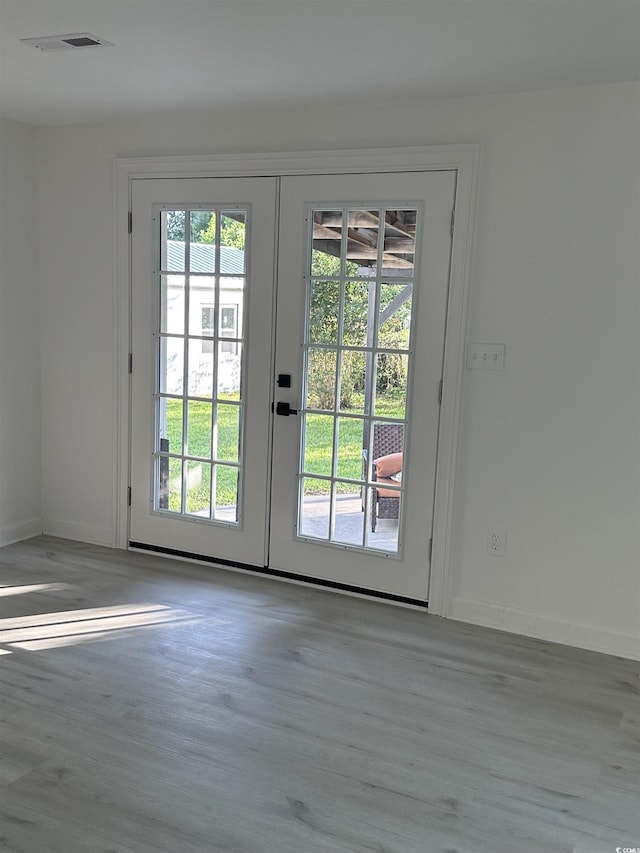 518 Nowell St, Georgetown, SC 29440 - doorway to outside featuring french doors, healthy amount of natural light, and wood finished floors