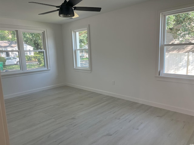 518 Nowell St, Georgetown, SC 29440 - unfurnished room featuring light wood-type flooring, healthy amount of natural light, and a ceiling fan