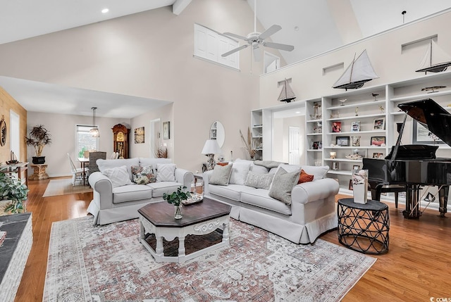 1064 Links Rd, Surfside Beach, SC 29575 - living room with a ceiling fan, high vaulted ceiling, wood finished floors, and beamed ceiling