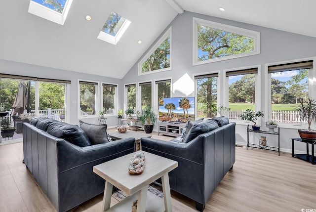 1064 Links Rd, Surfside Beach, SC 29575 - living room with high vaulted ceiling, a skylight, light wood-type flooring, recessed lighting, and beam ceiling