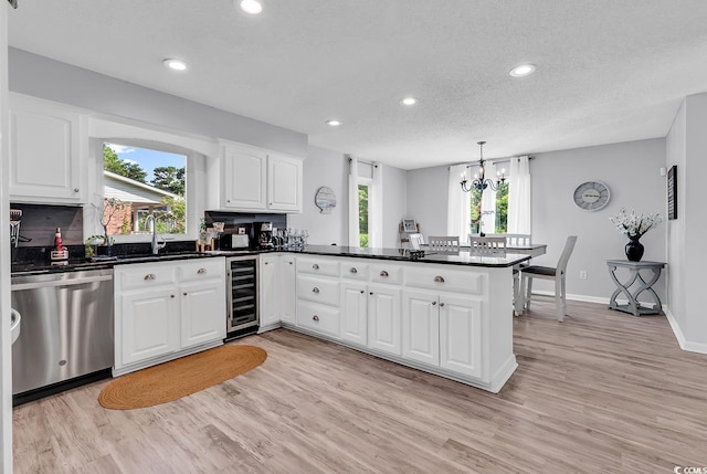 1064 Links Rd, Surfside Beach, SC 29575 - kitchen featuring dishwasher, beverage cooler, a peninsula, recessed lighting, and light wood-type flooring