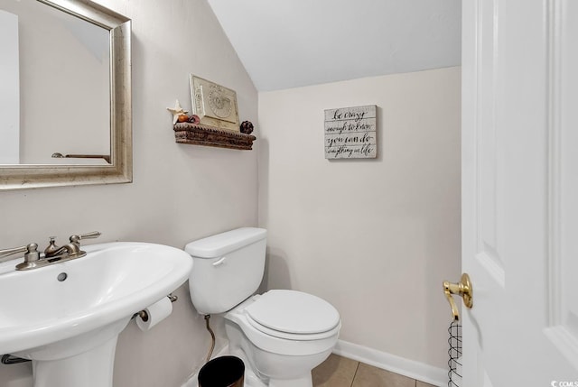 1064 Links Rd, Surfside Beach, SC 29575 - half bathroom featuring vaulted ceiling and tile patterned floors