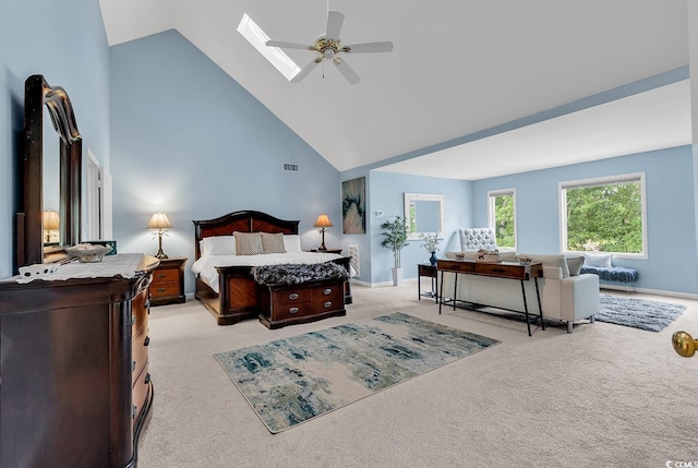1064 Links Rd, Surfside Beach, SC 29575 - bedroom featuring light carpet, high vaulted ceiling, a skylight, and ceiling fan