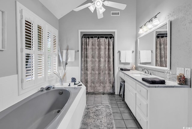 1064 Links Rd, Surfside Beach, SC 29575 - bathroom featuring vanity, a garden tub, vaulted ceiling, a ceiling fan, and tile patterned flooring
