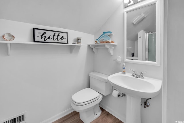 1064 Links Rd, Surfside Beach, SC 29575 - bathroom featuring wood finished floors, lofted ceiling, and a shower
