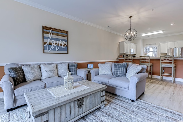 110 S Shore Blvd Unit 203, Longs, SC 29568 - living area featuring light wood-style floors, ornamental molding, a chandelier, and recessed lighting
