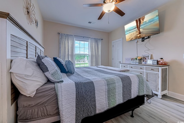 110 S Shore Blvd Unit 203, Longs, SC 29568 - bedroom with light wood finished floors and a ceiling fan