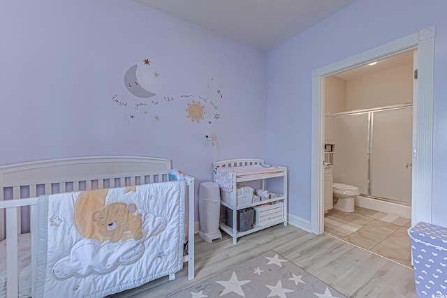 110 S Shore Blvd Unit 203, Longs, SC 29568 - bedroom featuring wood finished floors and ensuite bath