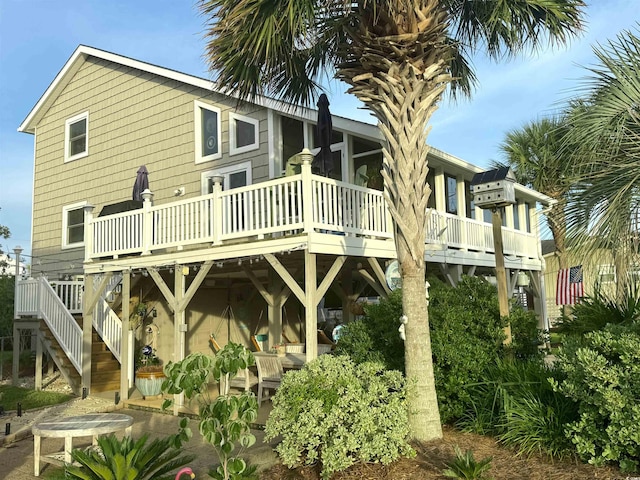 404 29th Ave N, North Myrtle Beach, SC 29582 - back of property featuring a wooden deck and stairway