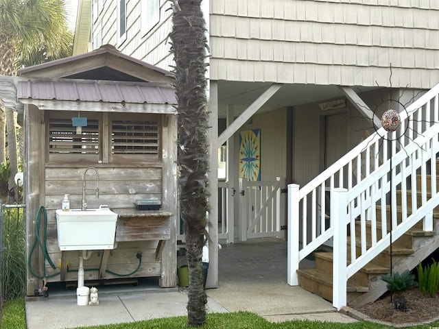 404 29th Ave N, North Myrtle Beach, SC 29582 - view of exterior entry featuring a sink