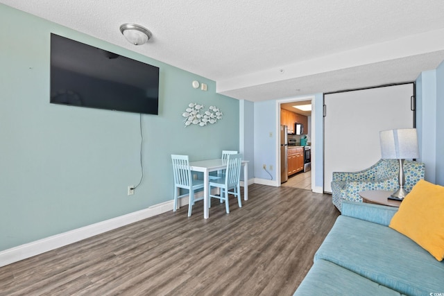 1501 S Ocean Blvd Unit 1039, Myrtle Beach, SC 29577 - living room featuring wood finished floors and a textured ceiling