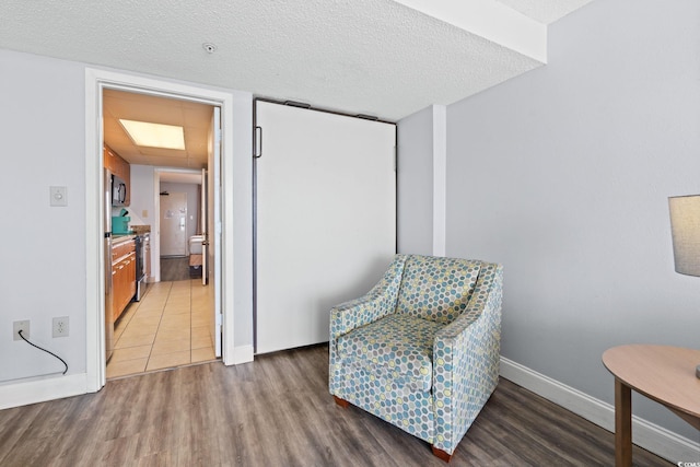 1501 S Ocean Blvd Unit 1039, Myrtle Beach, SC 29577 - living area with wood finished floors and a textured ceiling