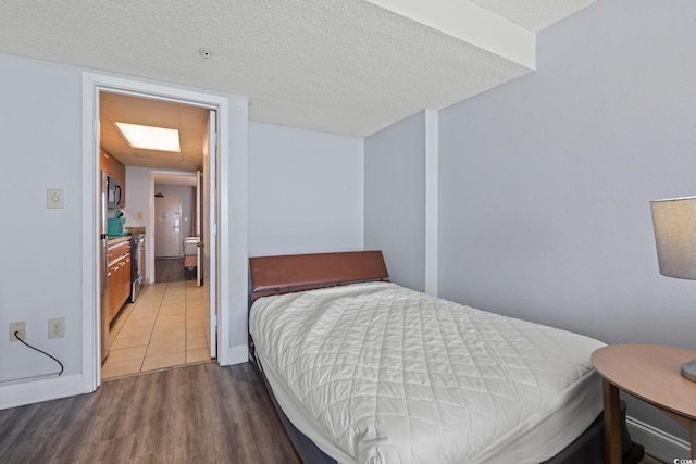 1501 S Ocean Blvd Unit 1039, Myrtle Beach, SC 29577 - bedroom featuring wood finished floors and a textured ceiling