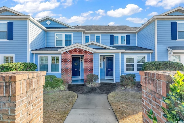 1857 Culbertson Ave Unit 1857, Myrtle Beach, SC 29577 - view of front of house featuring roof with shingles and brick siding