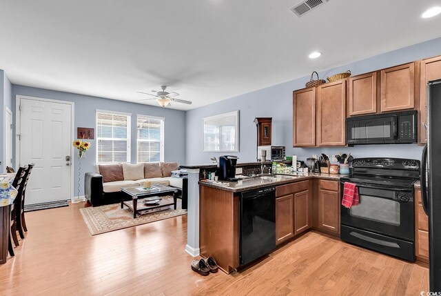 1857 Culbertson Ave Unit 1857, Myrtle Beach, SC 29577 - kitchen featuring black appliances, a peninsula, light wood-style floors, ceiling fan, and recessed lighting