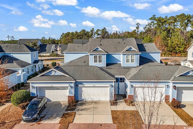 1857 Culbertson Ave Unit 1857, Myrtle Beach, SC 29577 - traditional-style home featuring concrete driveway, a residential view, roof with shingles, and a garage