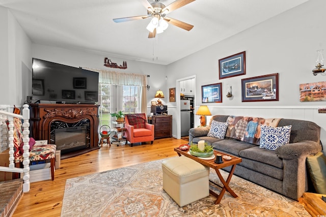 1005 S Main St, Mullins, SC 29574 - living room featuring a ceiling fan, wood finished floors, and a glass covered fireplace
