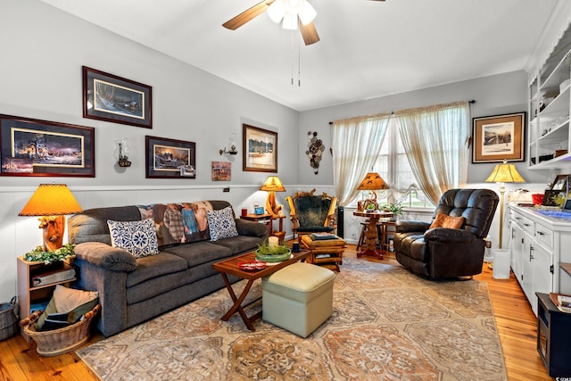 1005 S Main St, Mullins, SC 29574 - living room with ceiling fan, light wood-style floors, and a wainscoted wall