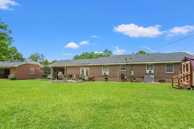 1005 S Main St, Mullins, SC 29574 - back of property with a yard, a carport, and a storage shed