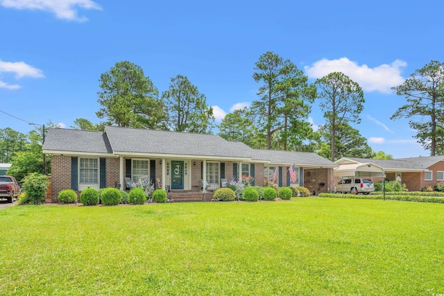 1005 S Main St, Mullins, SC 29574 - single story home with a front yard, brick siding, and covered porch