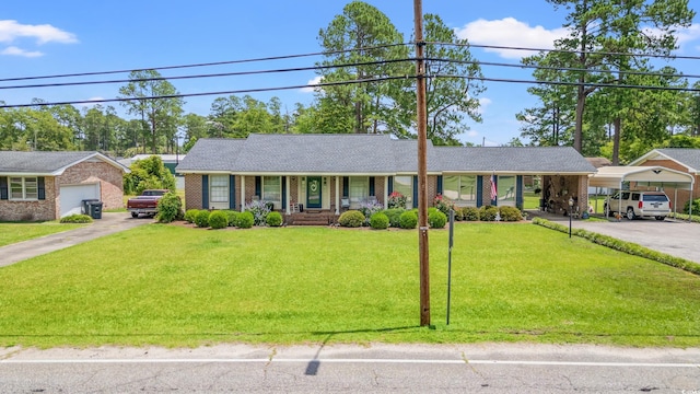 1005 S Main St, Mullins, SC 29574 - single story home featuring covered porch, a front yard, brick siding, and driveway