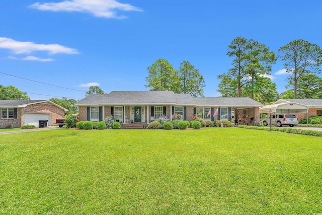 1005 S Main St, Mullins, SC 29574 - single story home featuring a front lawn, brick siding, and a porch