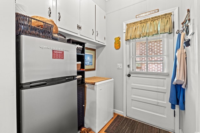 1005 S Main St, Mullins, SC 29574 - laundry room with wood finished floors and baseboards