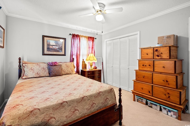 1005 S Main St, Mullins, SC 29574 - carpeted bedroom with a closet, crown molding, ceiling fan, and a textured ceiling