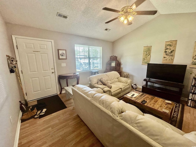 706 Jamie Ln, Conway, SC 29526 - living area with wood finished floors, ceiling fan, vaulted ceiling, and a textured ceiling