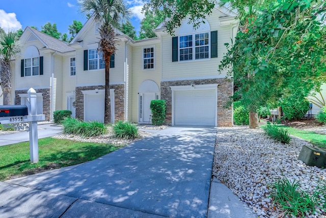 4355 Rivergate Ln Unit F, Little River, SC 29566 - view of front of property featuring stone siding, driveway, and a garage