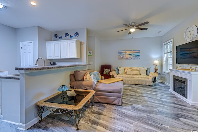 4355 Rivergate Ln Unit F, Little River, SC 29566 - living room with a ceiling fan, a glass covered fireplace, recessed lighting, and light wood-style floors