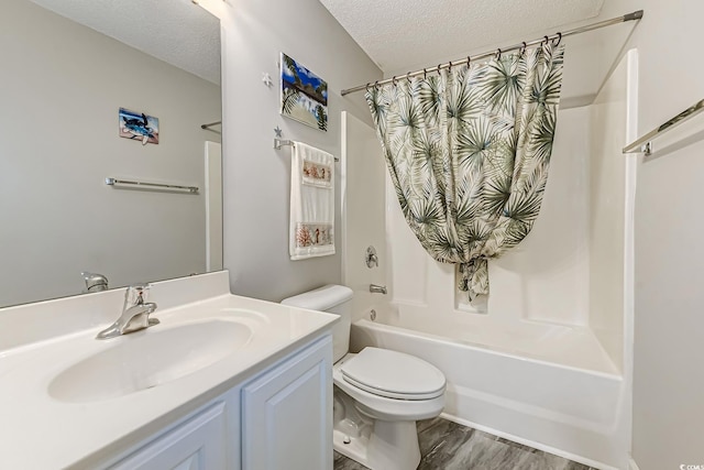 4355 Rivergate Ln Unit F, Little River, SC 29566 - full bath featuring a textured ceiling, shower / bathtub combination with curtain, vanity, and wood finished floors