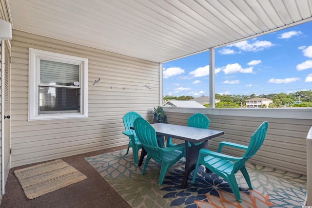1011 S Ocean Blvd Unit 301, North Myrtle Beach, SC 29582 - sunroom with outdoor dining area