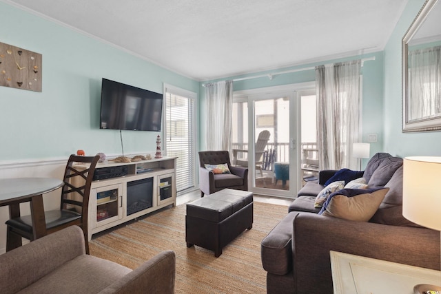 1011 S Ocean Blvd Unit 301, North Myrtle Beach, SC 29582 - living room featuring crown molding and a wainscoted wall