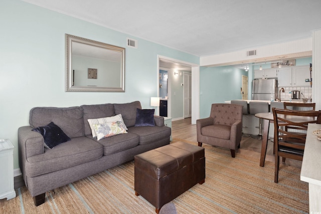 1011 S Ocean Blvd Unit 301, North Myrtle Beach, SC 29582 - living area featuring light wood finished floors