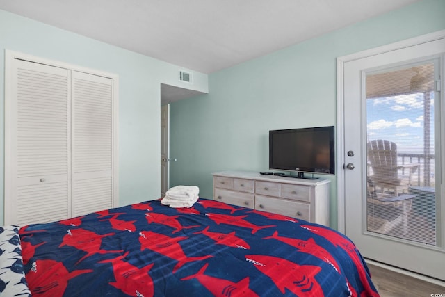 1011 S Ocean Blvd Unit 301, North Myrtle Beach, SC 29582 - bedroom featuring wood finished floors and a closet