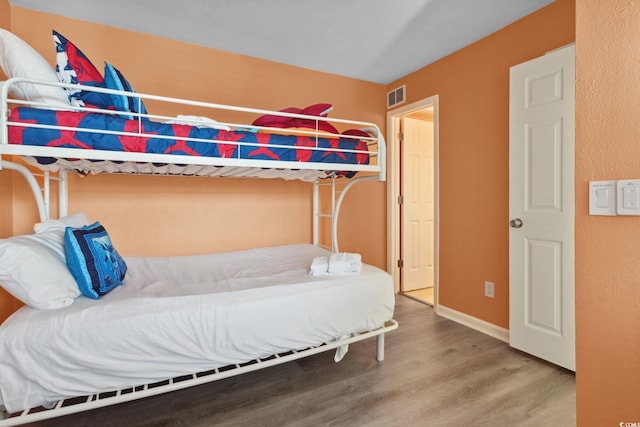 1011 S Ocean Blvd Unit 301, North Myrtle Beach, SC 29582 - bedroom featuring wood finished floors and baseboards