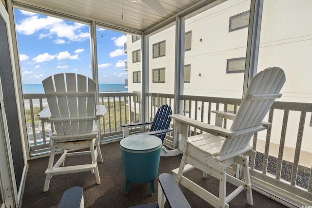 1011 S Ocean Blvd Unit 301, North Myrtle Beach, SC 29582 - sunroom featuring a water view and ceiling fan