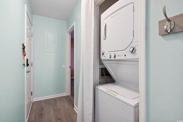 1011 S Ocean Blvd Unit 301, North Myrtle Beach, SC 29582 - laundry area with estacked washer and dryer, electric panel, and wood finished floors