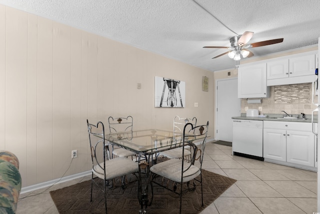 6301 N Ocean Blvd Unit 2B, North Myrtle Beach, SC 29582 - dining area featuring a ceiling fan, a textured ceiling, and light tile patterned flooring