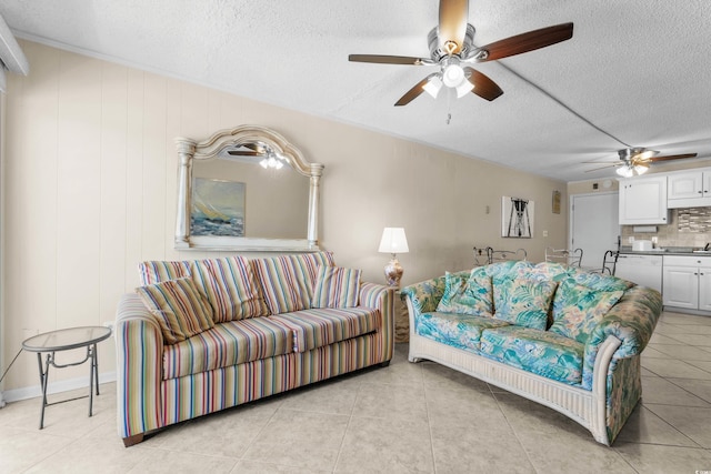 6301 N Ocean Blvd Unit 2B, North Myrtle Beach, SC 29582 - living room featuring a textured ceiling, ceiling fan, and light tile patterned flooring