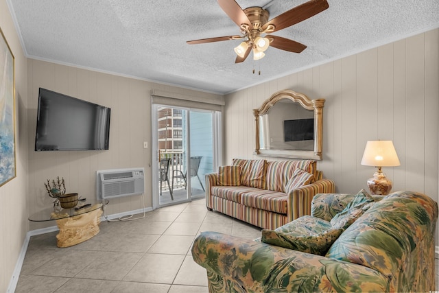 6301 N Ocean Blvd Unit 2B, North Myrtle Beach, SC 29582 - tiled living room with crown molding, a wall unit AC, ceiling fan, and a textured ceiling