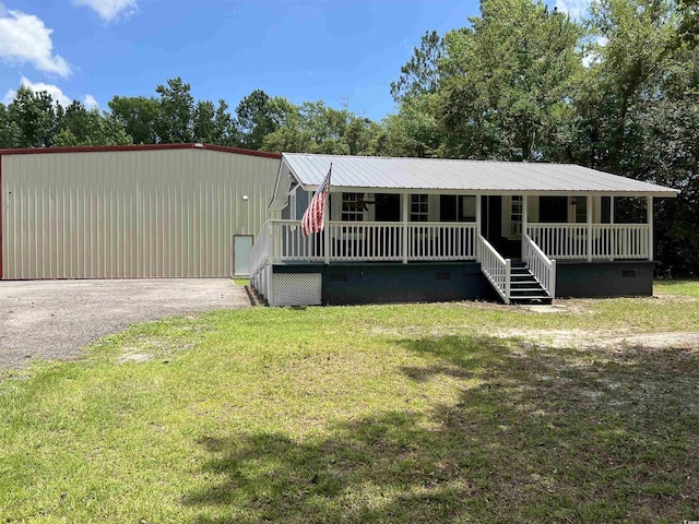 2879 Waccamaw Cv, Longs, SC 29568 - manufactured / mobile home with a porch, crawl space, a front lawn, and a metal roof