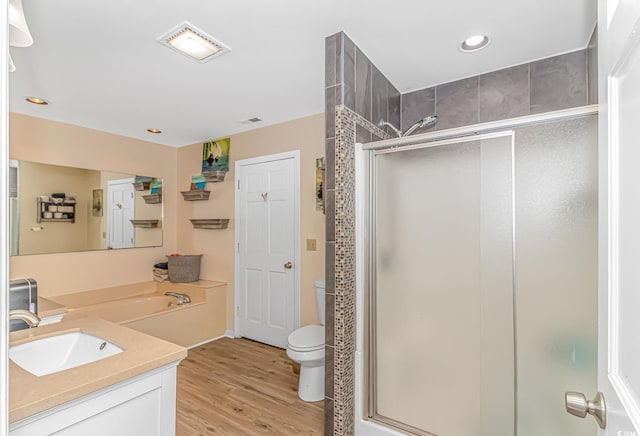 189 Aspen Loop, Pawleys Island, SC 29585 - bathroom with a stall shower, vanity, wood finished floors, and recessed lighting
