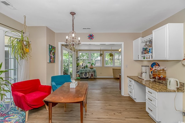 189 Aspen Loop, Pawleys Island, SC 29585 - living area with light wood-type flooring, a chandelier, and an office area