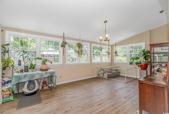 189 Aspen Loop, Pawleys Island, SC 29585 - sunroom featuring wood finished floors, healthy amount of natural light, a chandelier, lofted ceiling, and a deck