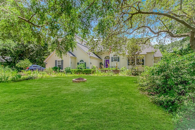 189 Aspen Loop, Pawleys Island, SC 29585 - view of grassy yard with a fire pit